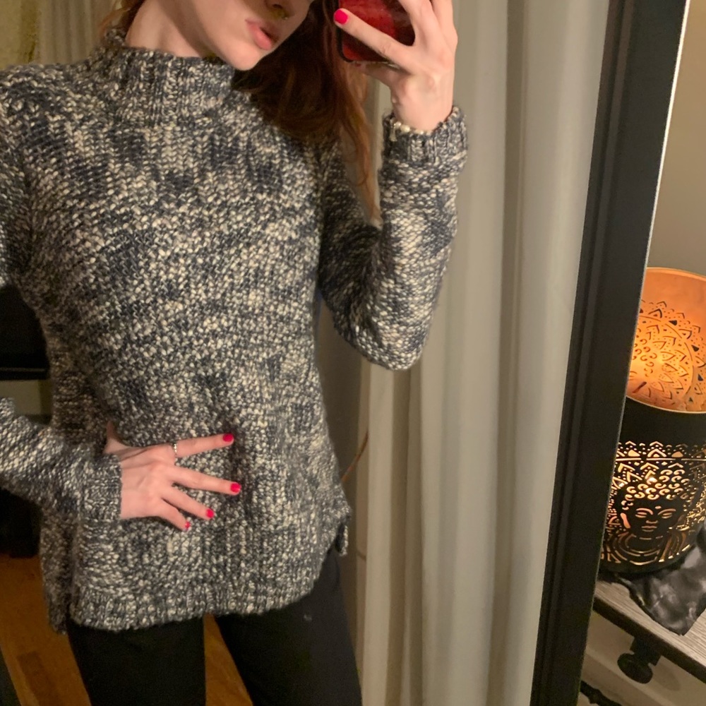 Purple and white sweater.